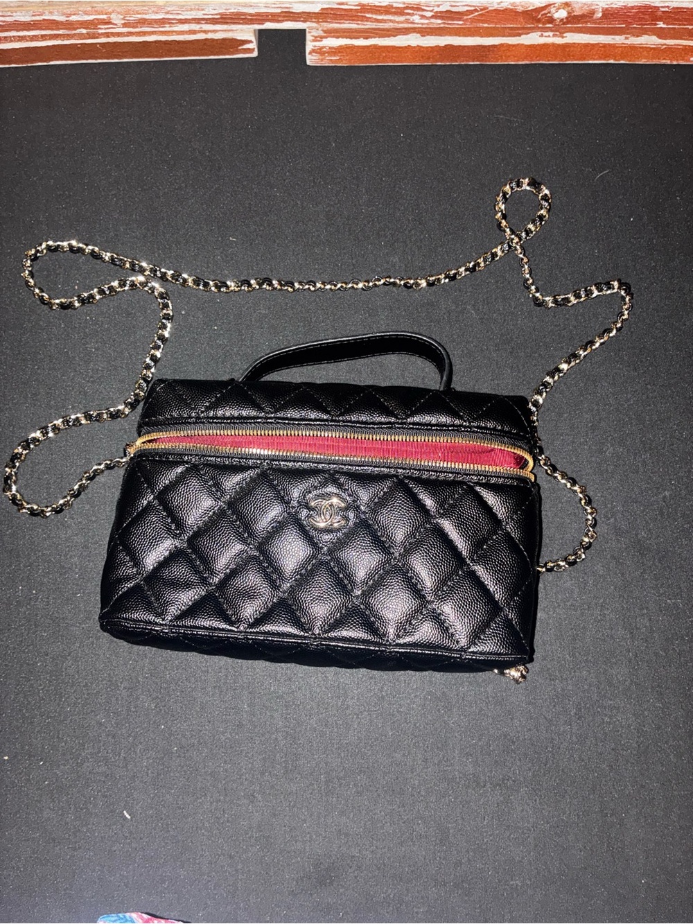 CHANEL Black Quilted Leather Crossbody with Red Zip Trim
